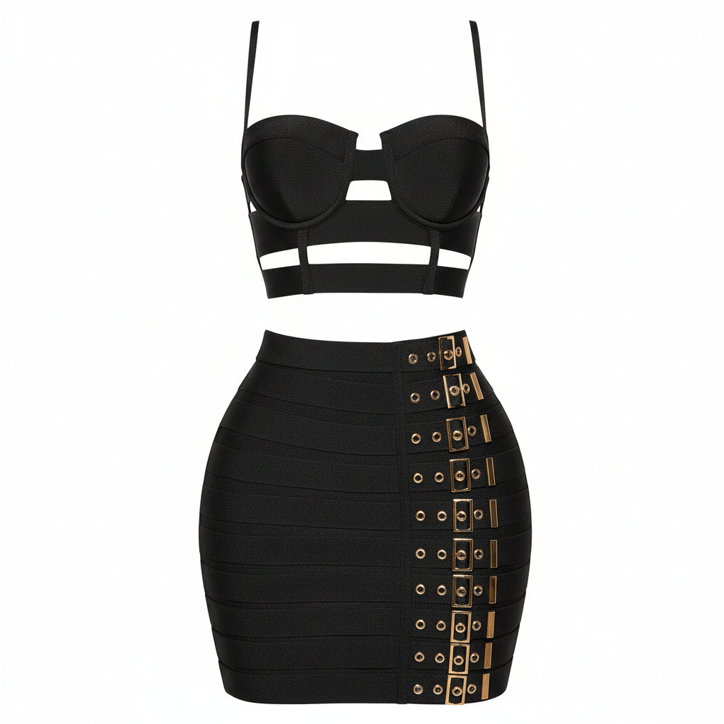 A two-piece black outfit featuring a strappy bandeau-style crop top and a high-waisted bodycon mini skirt with gold-tone buckle detailing along the side, shown on a plain white background.