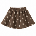A brown knit tiered skirt with a white daisy pattern, featuring an elastic waistband, shown against a plain white background.