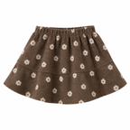 A brown knit tiered skirt with a white daisy pattern, featuring an elastic waistband, shown against a plain white background.
